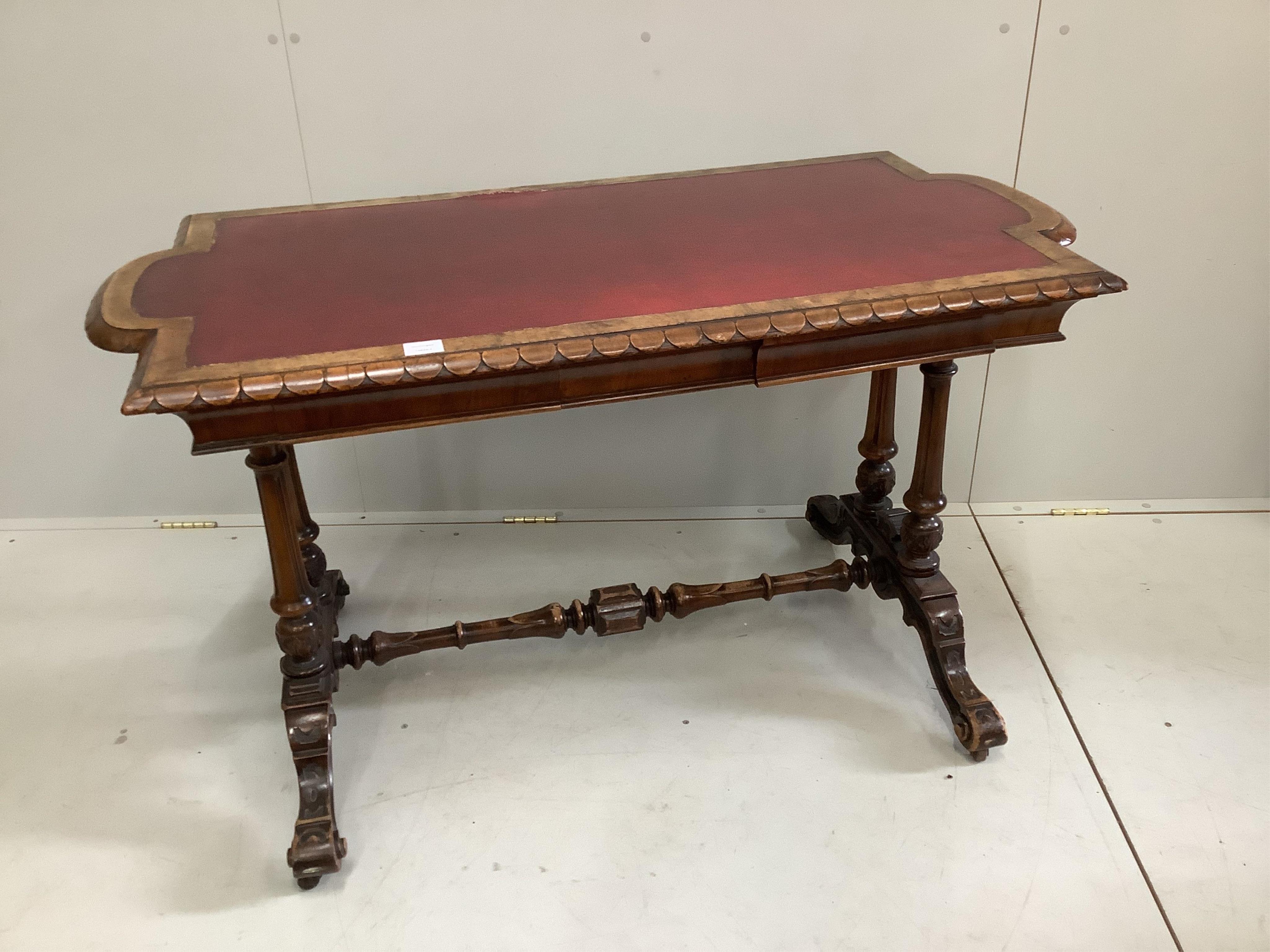 An early Victorian rectangular walnut writing table, width 126cm, depth 64cm, height 73cm. Condition - fair